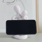 Couple embrace phone holder sculpture, resin craft decorative figurine